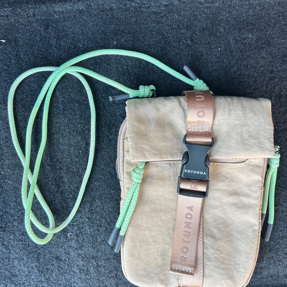 Rotunda Tan Crossbody Bag with Green Straps